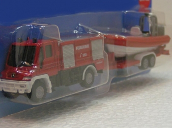 Mercedes Unimog + boat on trailer